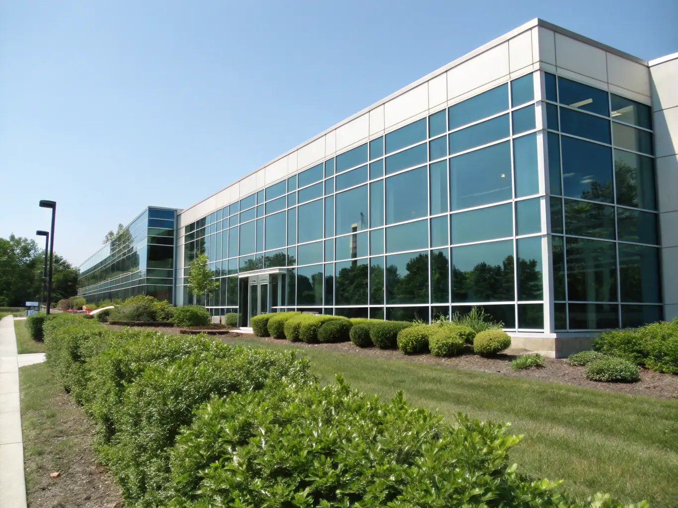 A modern office building with a sign indicating 'Commercial Insurance Solutions'. The image should convey professionalism and reliability.